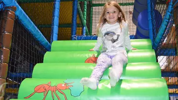 Girl at Hullabazoo children's indoor play area at Whipsnade Zoo