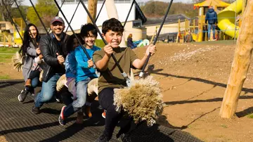 A family enjoying Hullabazoo Adventure Play at ZSL Whipsnade Zoo