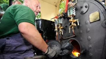 The railway team prepare the steam engine for its journey at Whipsnade Zoo