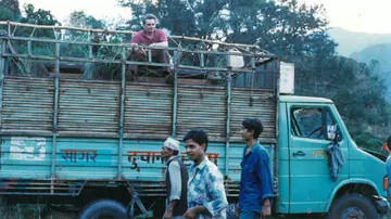 Zookeeper Andy White on the back of a truck 