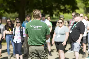 A member of Whipsnade staff speaking outside to educators