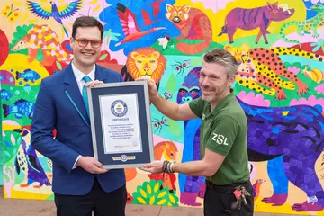 Long serving zookeeper Glynn Hennessy accepts Guinness World Record certificate