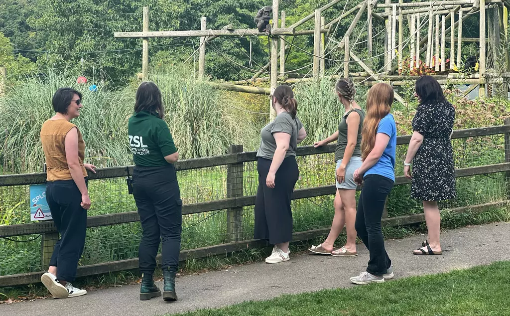 Whipsnade Zoo staff member engaging with teachers at chimps