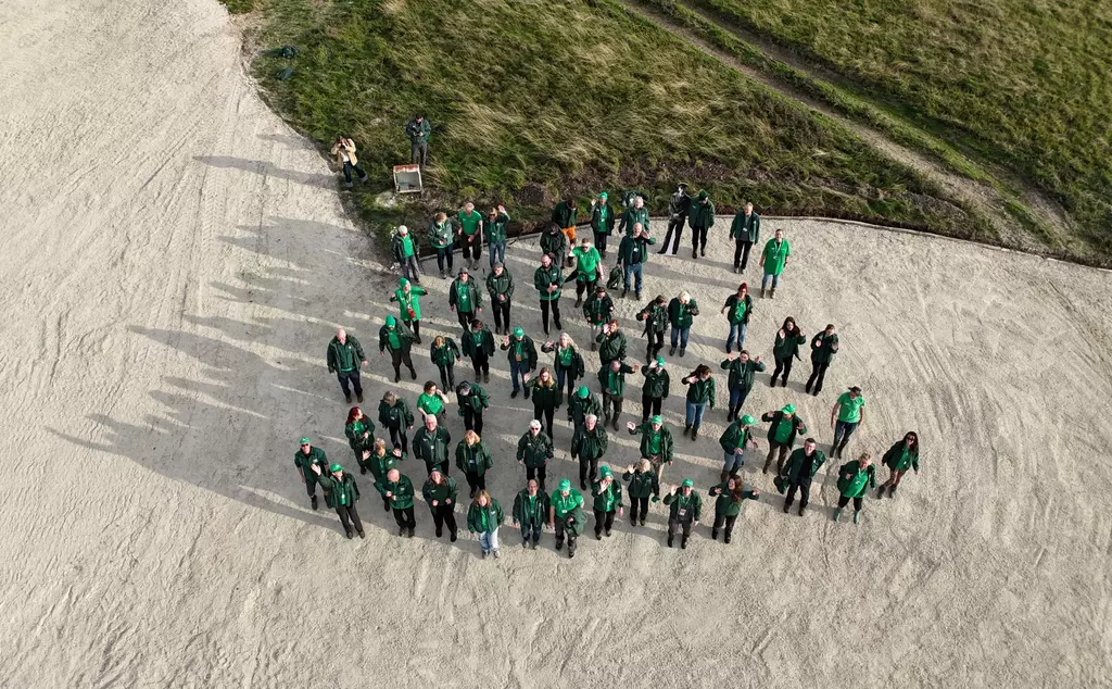 65 volunteers gathered to stamp the white lion chalk